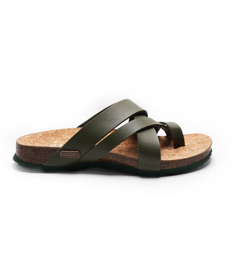 Green sandal with cork sole on a white background