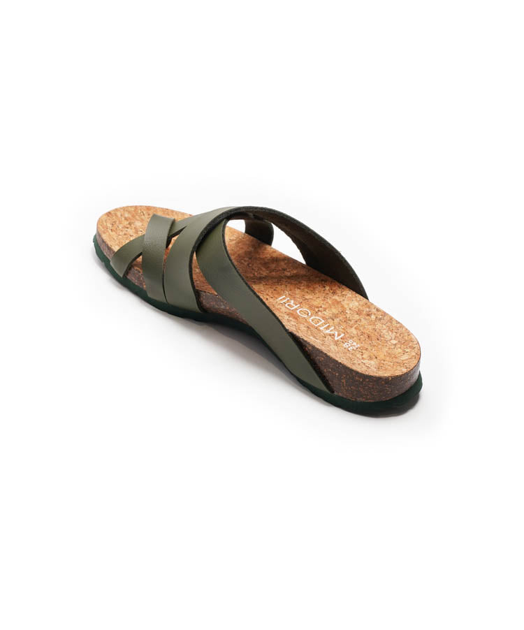 Green sandal with cork sole on a white background