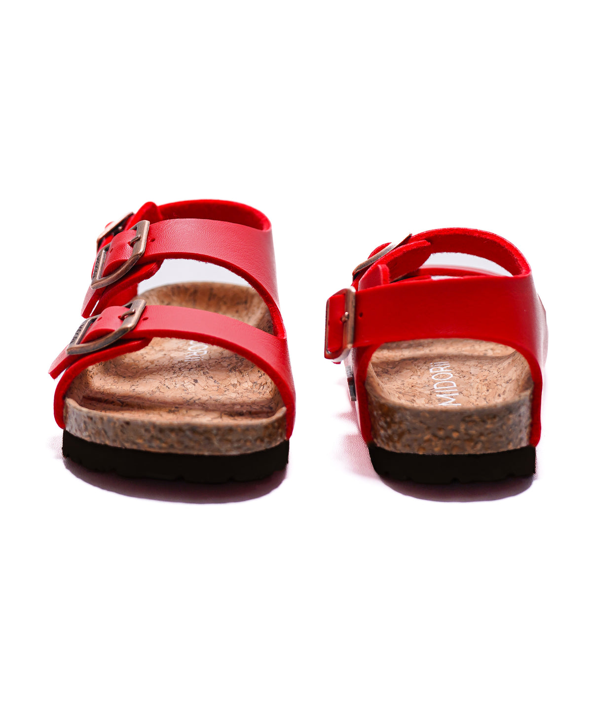 A pair of red leather double-strap sandals with silver-tone buckles and cork-look midsoles, shown from the back on a white background.
