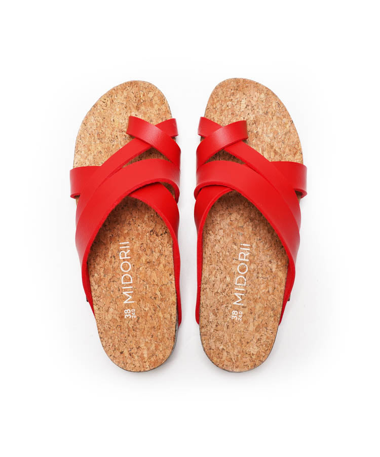 Red sandals with cork soles on a white background