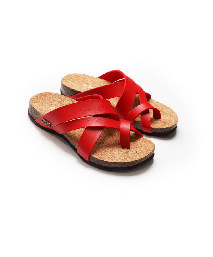 Red sandals with cork feet on a white background